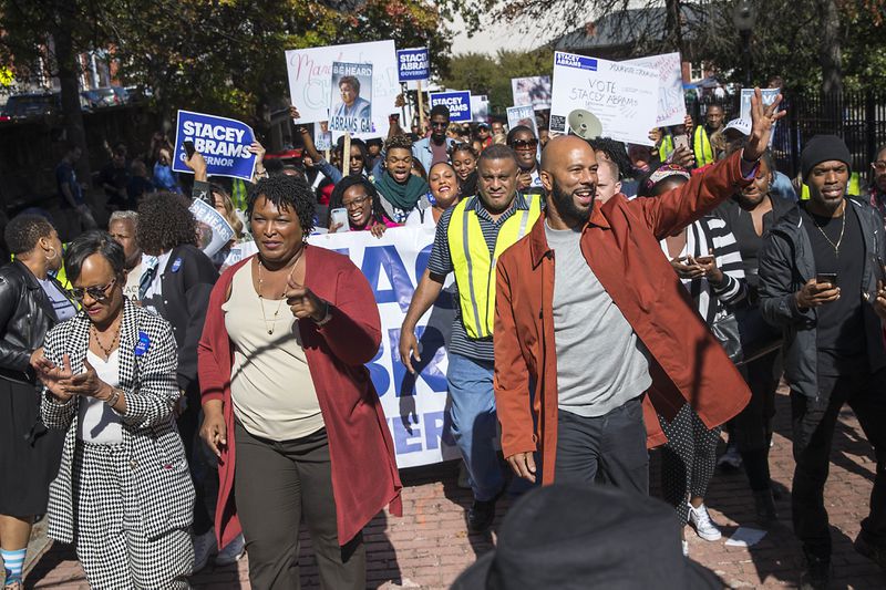 Former Georgia Gubernatorial candidate Stacey Abrams (second from left) was joined by Grammy Award-winning rapper Common (right of Abrams), Attorney Glenda Hatchet (left) and supporters as during a Souls to the Polls rally and march in downtown Atlanta on October 28, 2018. Common said this week that had he been asked to perform at the Super Bowl, he would have said no. (ALYSSA POINTER/ALYSSA.POINTER@AJC.COM)