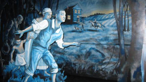 This mural by Cincinnati artist Kyle Penunuri is called "Following the Tracks of the Underground Railroad in Warren County." (AJC FIle)