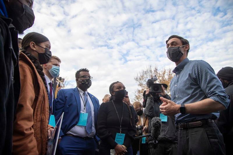 Georgia Senate Democrat candidate Jon Ossoff speaks with Kennesaw State University student leaders following a rally in the parking lot of Grace Community Christian Church in Kennesaw on Dec. 3, 2020.  (Alyssa Pointer / Alyssa.Pointer@ajc.com)