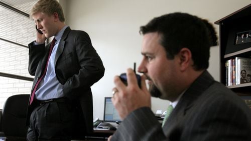 Nick Ayers, left, and Derrick Dickey in Sonny Perdue's campaign headquarters in May 2006. Ayers was Perdue's campaign manager at the time and went on to become Vice President Mike Pence's chief of staff. Dickey, Perdue's onetime press aide, is now U.S. Sen. David Perdue's top aide. (LOUIE FAVORITE/AJC staff)