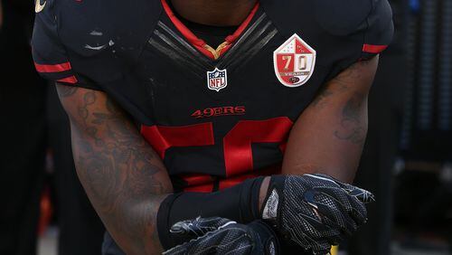 San Francisco 49ers linebacker Eli Harold takes a knee during the National Anthem prior to an NFL football game against the Arizona Cardinals earlier this month in Santa Clara, CA. (Daniel Gluskoter/AP Images)