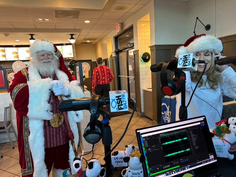 Long-time Fish 104.7 afternoon host Beth Bacall showed up at the Jett Ferry Road Chick fil-A in Dunwoody Dec. 14 , 2023 with Santa Claus to promote the station's Christmas Wish program. RODNEY HO/rho@ajc.com