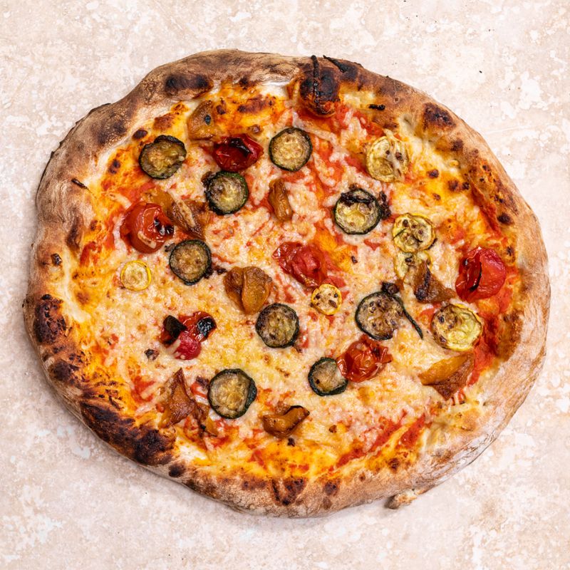 The Giardino pizza from Pizza Verdura Sincera includes seasonal vegetables like zucchini and onion. / Courtesy of Pizza Verdura Sincera