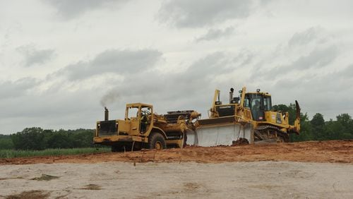 May 3, 2013 - Fayetteville: A heavy equipment operator uses a bulldozer to prepare farm land for the construction of Pinewood Studios on Friday, May 3, 2013 in Fayetteville, GA. Once construction is complete it will be the largest movie studio east of the Mississippi River. JCRAWFORD@AJC.COM