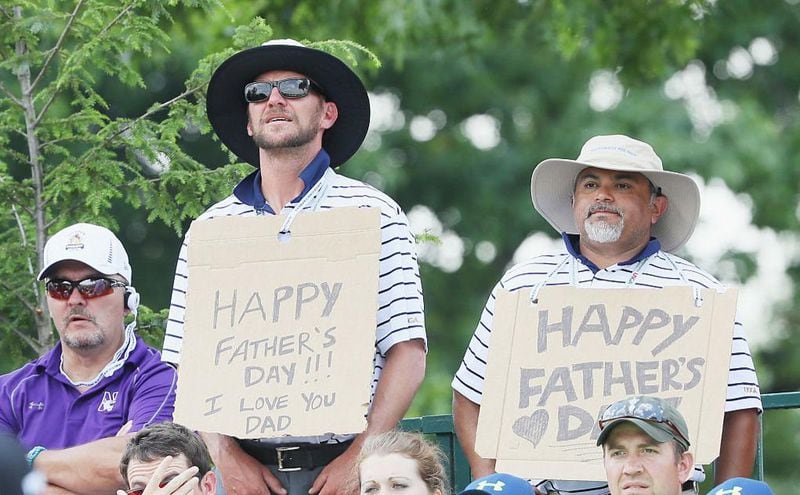 OAKMONT, PA - JUNE 19: Fans hold Father's Day signs near the first hole during the final round of the U.S. Open at Oakmont Country Club on June 19, 2016 in Oakmont, Pennsylvania.  (Photo by Andrew Redington/Getty Images)