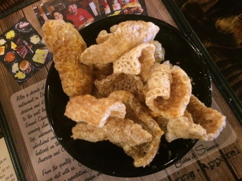 The pork rinds at Bub-Ba-Q in Woodstock are addictively seasoned, not too oily, crunchy and fresh. LIGAYA FIGUERAS / LIGAYA.FIGUERAS@AJC.COM
