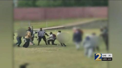 A woman was charged with affray this week in connection with an October fight after a youth football game in Clayton County.