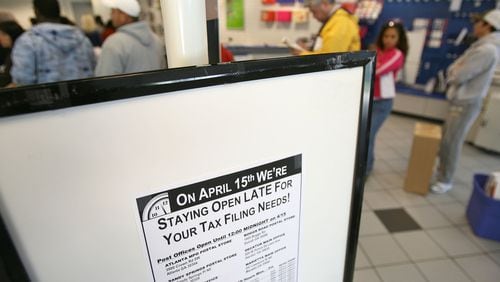 Post offices, such as the Boggs Road Post Office in Duluth, extend hours to midnight on tax filing deadline day, usually April 15, to help last minute tax filers. Congress extended the deadline to July 15 this year because of the coronavirus. Photo by Vino Wong / AJC