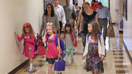 Kindergarten students head to class at a Fulton County elementary school. Parents wishing to register their prospective kindergartners for next fall will be able to do so on two days next month. (AJC file)