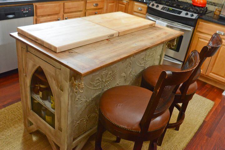 Wooden kitchen island salvaged from old church