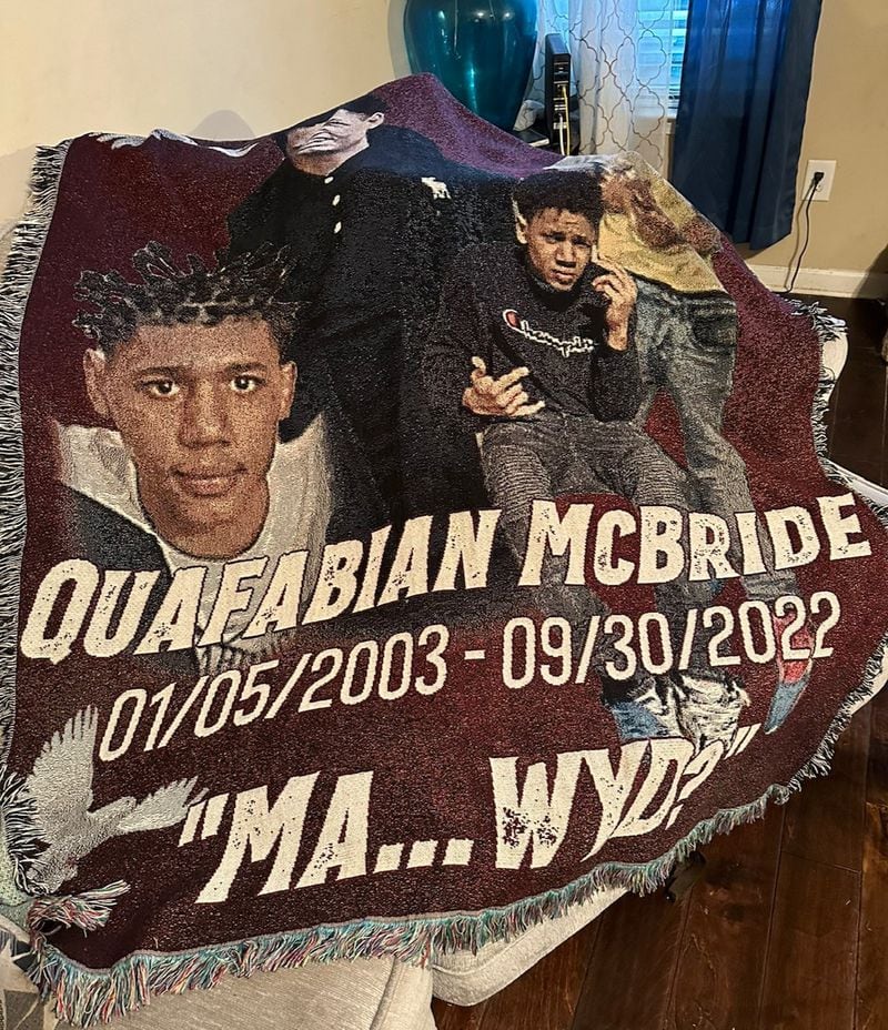 Lavonia McBride, the mother of Quafabian McBride, keeps a blanket that commemorates him on her couch at her Augusta home. She says that she’s ready to deal with any evidence that might emerge about her son’s role in the violence that led to his death. “I can live with the truth,” she said. (Danny Robbins/For The Atlanta Journal-Constitution)