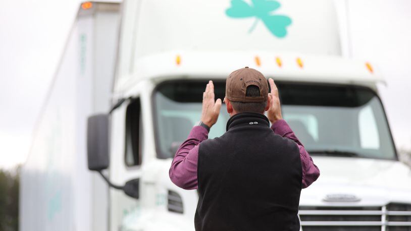 Jeff Keeney, director of training at Daly's Truck Driving School, directs a student during a test in November. The school turned out about 1,700 students last year and is operating at full tilt, which could help address trucking backlogs. Miguel Martinez for The Atlanta Journal-Constitution