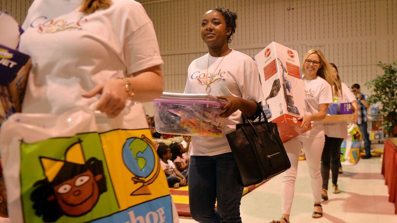 Google Atlanta employees bring out the supplies. Atlanta Mayor Kasim Reed surprised teachers and students at Whitefoord Elementary School by announcing a surprise gift of $25,000 in school supplies by Google Atlanta. Every project requested by teachers at the school was funded.