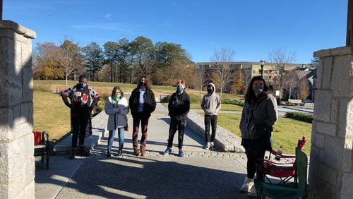 Junior high students at the Academy, a hybrid home-school option for students that combines in-person and self-directed learning, are pictured with Karen Seaver, a student teacher from Agnes Scott. Image courtesy of the Academy.