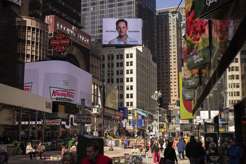A billboard calling for release of Wall Street Journal reporter Evan Gershkovich, is seen on the one year anniversary of his imprisonment in Russia, in New York's Times Square, Friday, March. 29, 2024. (AP Photo/Yuki Iwamura)