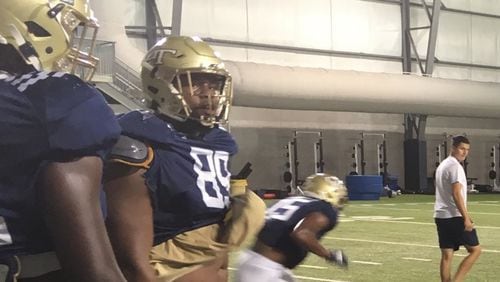 Georgia Tech players, including defensive lineman Antwan Owens, wore new gold facemasks on their helmets at Tuesday's practice, September 24, 2019, in advance of their game at Temple on Saturday. (AJC photo by Ken Sugiura)