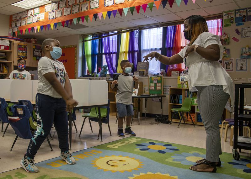Cascade Elementary School Kindergarten teacher Shiron Jelks participates in a sing along lesson with her students during the Atlanta Public Schools' Summer Academic Recovery Academy at Cascade Elementary School in Atlanta on Wednesday, June 2, 2021.  (Alyssa Pointer / Alyssa.Pointer@ajc.com)