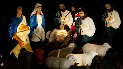 A life-size nativity scene glows in a yard in Pasadena, California.