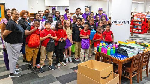 Huie students, Amazon employees, representatives from Clayton County Public Schools, Huie Elementary School, and Amazon Delivery Service provider Delivery King Logistics, are pictured with the donation of school supplies. (Photo provided by Clayton News-Daily)