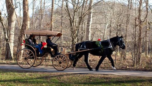 A couple takes a carriage ride through Blackberry Farm, a resort at the foothills of the Great Smoky Mountains. CONTRIBUTED BY BLACKBERRY FARM