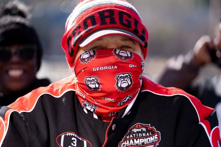 Pam Davis, who drove to Athens from Jacksonville, is all bundled up to stay warm while waiting for the Dawg Walk before the UGA football celebration Saturday, Jan. 14, 2023 in Athens. Ben Gray for the Atlanta Journal-Constitution