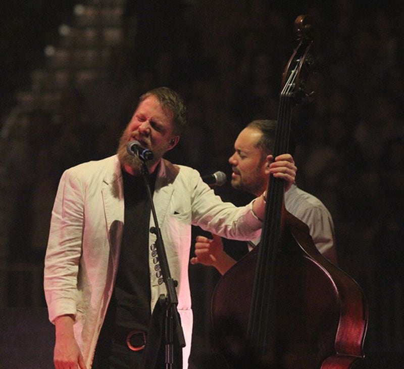 Mumford & Sons bassist Ted Dwane and keyboardist Ben Lovett play during the band's sold-out show March 20, 2019 at State Farm Arena. Photo: Melissa Ruggieri/Atlanta Journal-Constitution