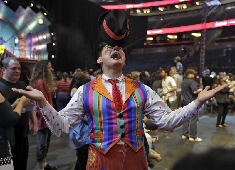 A Ringling Bros. and Barnum & Bailey clown balances a hat on his nose during a pre show for fans Saturday, Jan. 14, 2017, in Orlando, Fla. The Ringling Bros. and Barnum & Bailey Circus will end the "The Greatest Show on Earth" in May, following a 146-year run of performances. Kenneth Feld, the chairman and CEO of Feld Entertainment, which owns the circus, told The Associated Press, declining attendance combined with high operating costs are among the reasons for closing. (AP Photo/Chris O'Meara)