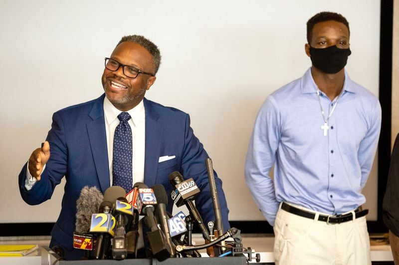  Roderick Walker (R) stands next to Attorney Shean Williams as Williams talks to the press during a press conference in Atlanta, September 18, 2020.  STEVE SCHAEFER / SPECIAL TO THE AJC 