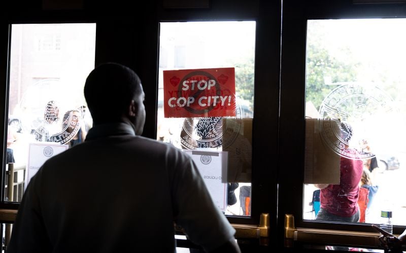 Protesters confront police at Atlanta City Hall ahead of the final vote to approve legislation to fund the public safety training center on Monday, June 5, 2023. (Arvin Temkar / arvin.temkar@ajc.com)