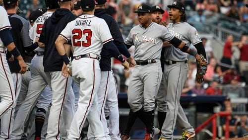 Jose Urena (right) was ejected after plunking the Braves' Ronald Acuna.