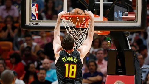 Hawks center Miles Plumlee (18) dunks during the first half of the team's NBA basketball game against the Miami Heat, Tuesday, April 3, 2018, in Miami. (AP Photo/Wilfredo Lee)