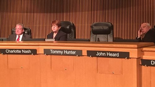 Gwinnett County Commissioner Tommy Hunter walked out of a Tuesday afternoon meeting as protesters began to speak.