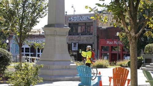 The Confederate monument sits behind the old courthouse in Decatur Square. BOB ANDRES /BANDRES@AJC.COM