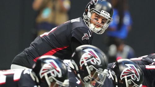 Falcons quarterback AJ McCarron calls a play at the line of scrimmage during the second quarter of preseason game against the Tennessee Titans Friday, Aug. 13, 2021, at Mercedes-Benz Stadium in Atlanta. (Curtis Compton / Curtis.Compton@ajc.com)
