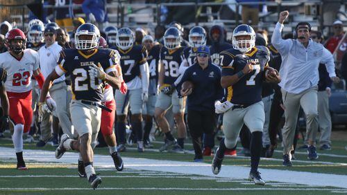 Ryan Thompson breaks away on a 75-yard scoring run in Reinhardt’s victory over Southeastern in the first round of the NAIA playoffs. Thompson leads the country in passing efficiency at 195.1.Credit: Reinhardt Athletics