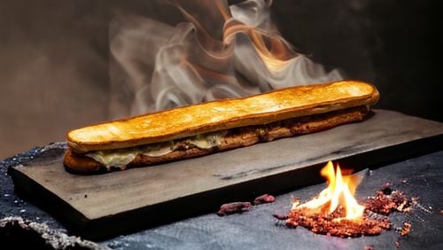 The two-foot-long “dueling” grilled cheese ($25) will be served during the 2023 SEC Championship Game at the 100 level Molly B's concession stand.