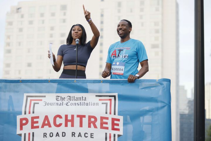 Maria Taylor and Atlanta Mayor Andre Dickens at the start of the 53rd running of the Atlanta Journal-Constitution Peachtree Road Race in Atlanta on Monday, July 4, 2022. (Miguel Martinez / Miguel.MartinezJimenez@ajc.com)