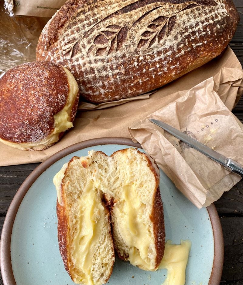 Osono Bread produced this country sour bread and two filled doughnuts, including one with horchata (on the plate) and one with cardamom. Wendell Brock for The Atlanta Journal-Constitution