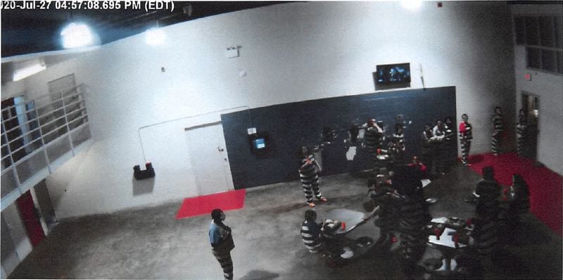 An image captured from surveillance video at the Coweta County Detention Center, where Officer Melvin Cameron saved an inmate choking on her food.