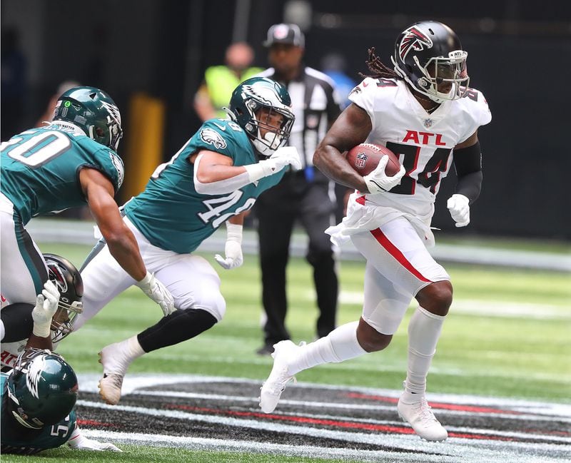 Falcons running back Cordarrelle Patterson picks up yardage against the Philadelphia Eagles during the first half Sunday, Sept. 12, 2021, at Mercedes-Benz Stadium in Atlanta. (Curtis Compton / Curtis.Compton@ajc.com)