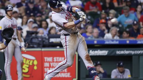 Atlanta Braves's Austin Riley hits an RBI single against the Houston Astros during the ninth inning of a baseball game Monday, April 15, 2024, in Houston. (AP Photo/Michael Wyke)