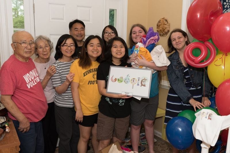 Helena and her family and friends celebrate her winning Georgia’s  “Doodle 4 Google” art competition.