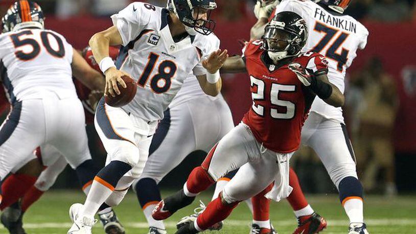 William Moore menaces some quarterback I've never heard of. (Jason Getz/AJC photo)