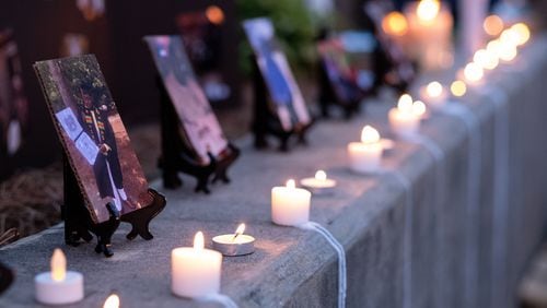 Candles line the wall before a memorial service for Kyle Gregory on July 24. He is one of nearly 5,000 Georgia residents who had died of COVID-19 by July 2020. The state's death toll has now surpassed 30,000. Photo: Ben Gray for the Atlanta Journal-Constitution