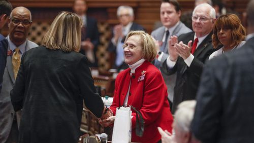 February 28, 2020 - Atlanta - Rep. Sharon Cooper (center),
R - Marietta, receives a standing ovation and  is congratulated by Speaker Pro-Tempore Jan Jones, R - Milton, after the passage of her bill.  The Georgia house passed  HB 987,  sponsored by Cooper, to provide additional measures for the protection of elderly persons and better regulate assisted living facilities.  Bob Andres / robert.andres@ajc.com