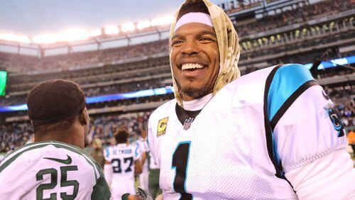 EAST RUTHERFORD, NJ - NOVEMBER 26:  Cam Newton #1 of the Carolina Panthers smiles following the Panthers' 35-27 win against the New York Jets at MetLife Stadium on November 26, 2017 in East Rutherford, New Jersey.  (Photo by Abbie Parr/Getty Images)