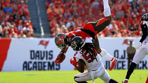 Buccaneers running back Peyton Barber is upended by the Falcons' De'Vondre Campbell in the regular season finale Sunday, Dec. 29, 2019, at Raymond James Stadium in Tampa, Fla.