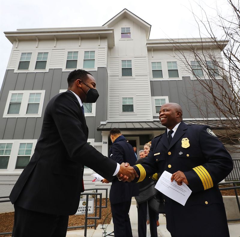 Atlanta Mayor Andre Dickens and Police Chief Rodney Bryant greet each other as they arrive at the ribbon cutting for Unity Place, an apartment complex for Atlanta Police recruits, on Wednesday, Feb. 2, 2022, in Atlanta. (Curtis Compton / Curtis.Compton@ajc.com)