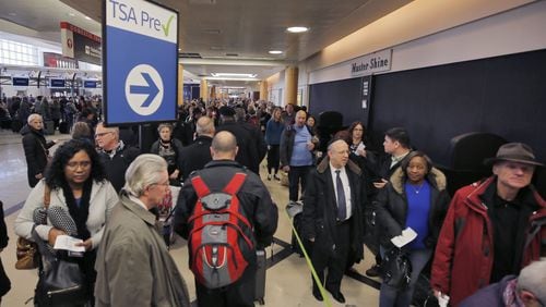 Security lines wrap through the atrium and around the baggage areas of Hartsfield-Jackson International Airport. BOB ANDRES /BANDRES@AJC.COM