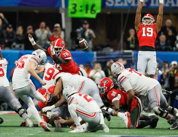 Ohio State Buckeyes place kicker Noah Ruggles (95) misses a field goal wide left at the end of the fourth quarter of the College Football Playoff Semifinal between the Georgia Bulldogs and the Ohio State Buckeyes at the Chick-fil-A Peach Bowl In Atlanta on Saturday, Dec. 31, 2022.  Georgia won, 42-41. (Jason Getz / Jason.Getz@ajc.com)